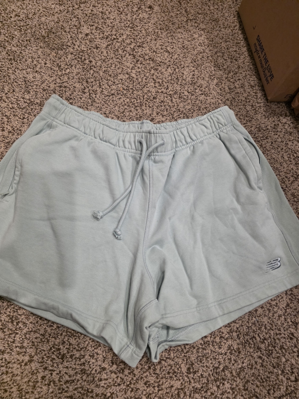 New Balance 5" French Terry Shorts in a light green